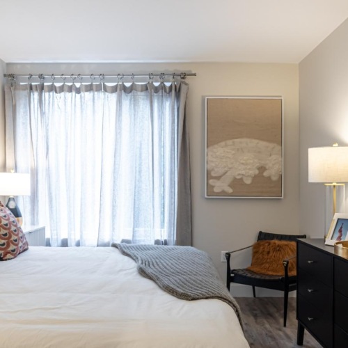 a bedroom with a bed and a desk