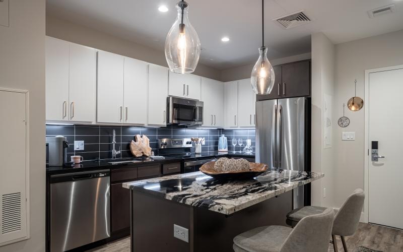 a kitchen with a marble counter top